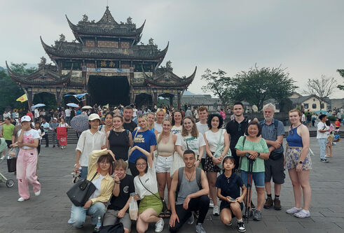 Josh and his exchange student companions pose in front of a Chinese temple