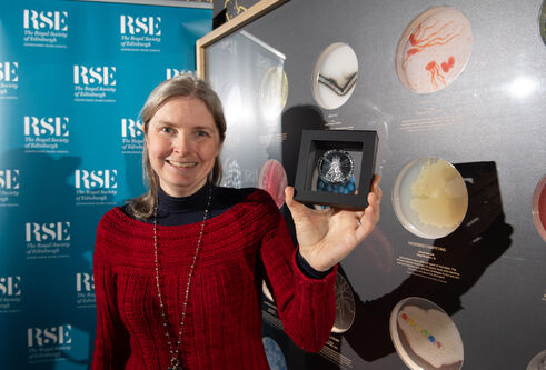 Prof Nicola Stanley-Wall FRSE with her medal at Dundee Science Centre