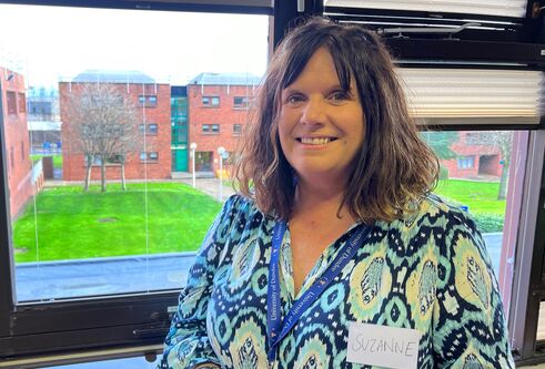 Suzanne Bell, standing in front of a window at Kirkcaldy campus