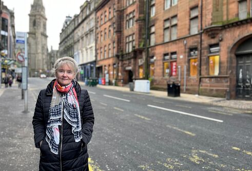 Professor Jill Belch standing on the pavement at Seagate, Dundee.