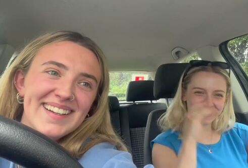 two girls sitting in a car
