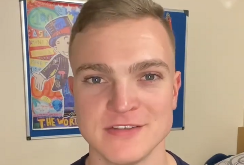 male student with microphone