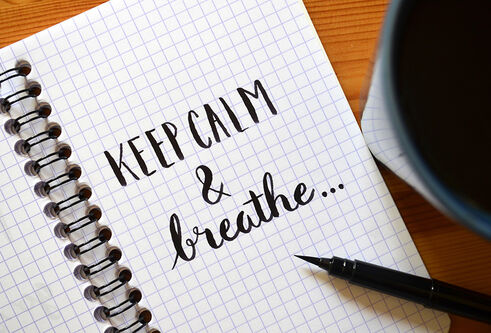 Notepad with the words 'Keep calm & breathe'