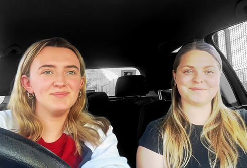 Two girls sitting in a car