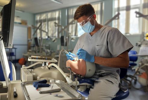Student sitting in phantom head room at University of Dundee School of Dentistry