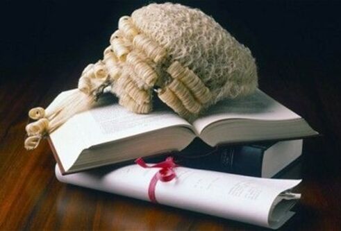 Judges wig sitting on a pile of books