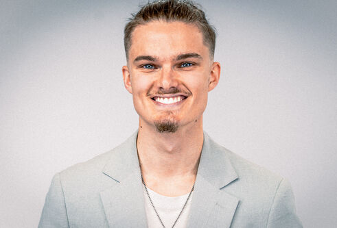 Nathan Dudley, smiling.