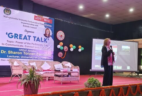 Woman giving speech on stage