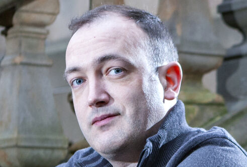 Headshot of Nick Brewer