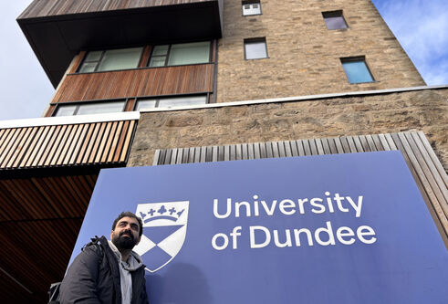 Raghav outside the Tower Building on city campus