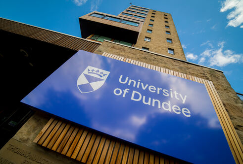 image of University of Dundee sign on the dies of a building