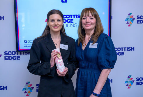 Justyna Skop stands alongside Marjory Sweeney of Scottish Enterprise with her award.jpg