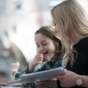Two students laughing