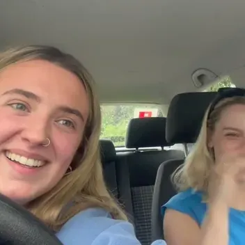 two girls sitting in a car