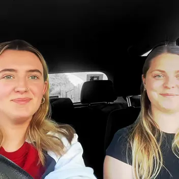 Two girls sitting in a car
