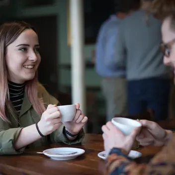 two students sharing coffee