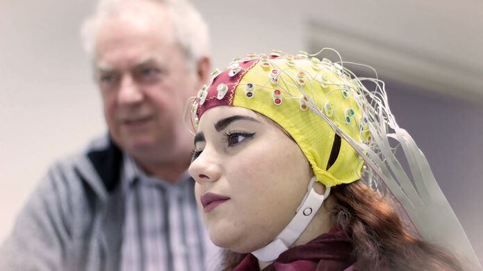 Woman wearing brain imaging cap