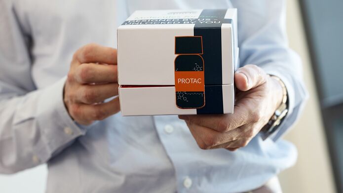 man holding protac box