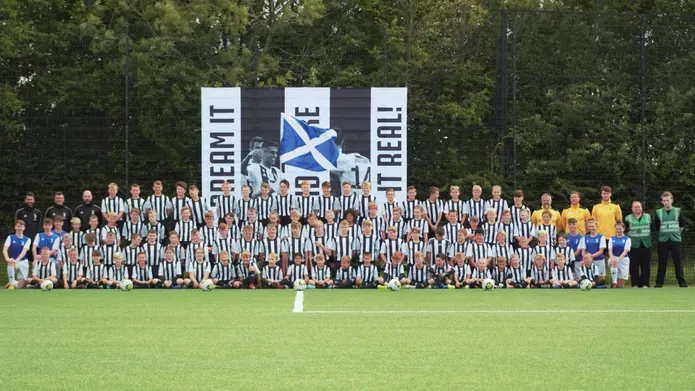 A large group of children in football strips