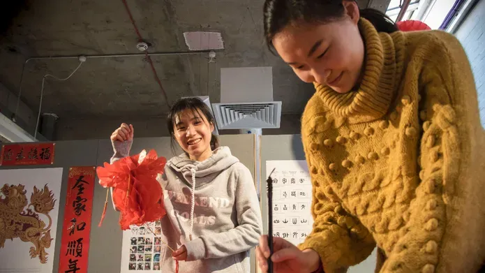 Students preparing decorations for Chinese New Year