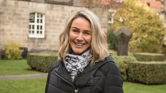 Portrait of Dr Emma Burnett standing outside
