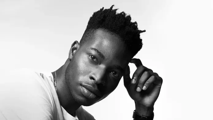 Black and white portrait photo of Howey Ejegi
