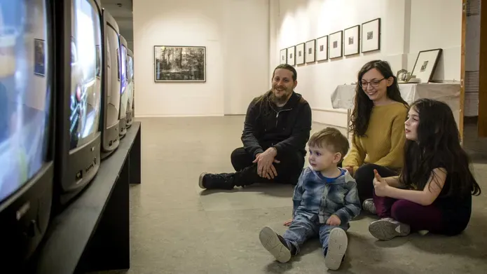 Family watching televisions