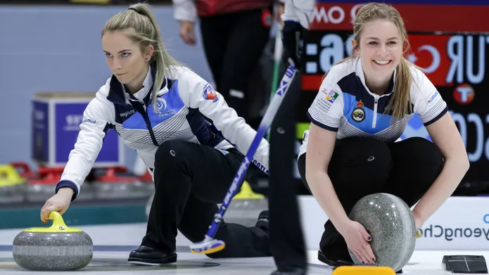 Leeanne McKenzie and Mili Smith on the curling ring