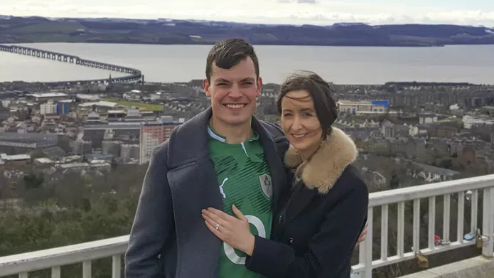 A student couple in front of the Firth of Tay