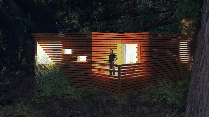 Luxury treehouse lit up at night