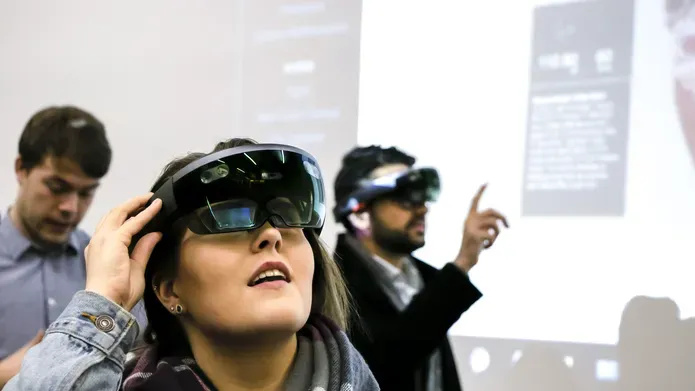 a woman with a mixed reality headset on