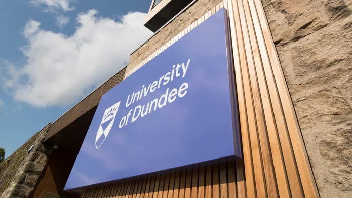 Tower Building with University of Dundee logo and blue skies above