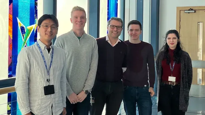 Five scientists from Dundee and Eisai standing in SLS building