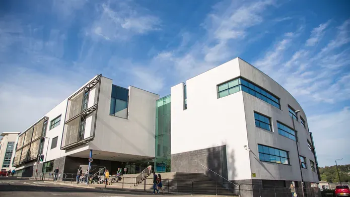 Dalhousie building with blue sky and clouds in the background.