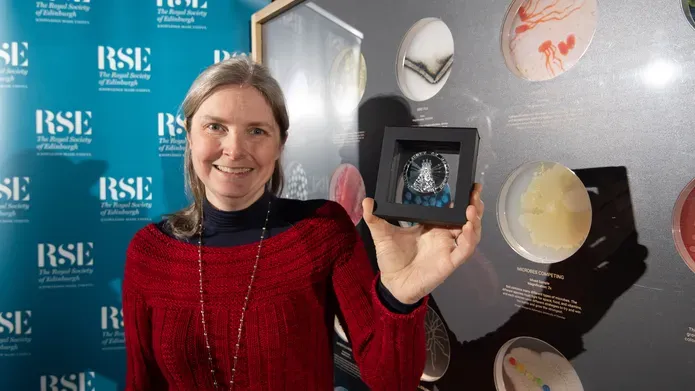 Prof Nicola Stanley-Wall FRSE with her medal at Dundee Science Centre