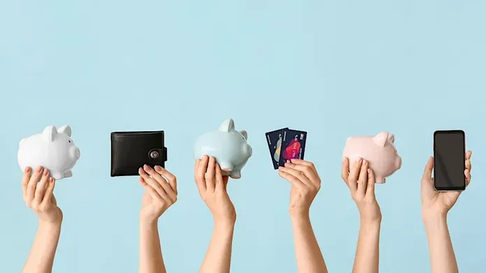 Hands in the air holding wallets and piggie banks