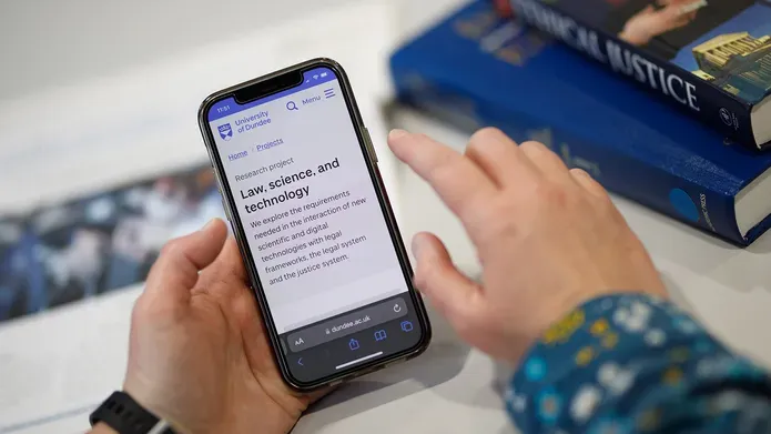 A person looking at a mobile screen
