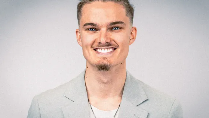 Nathan Dudley, smiling.