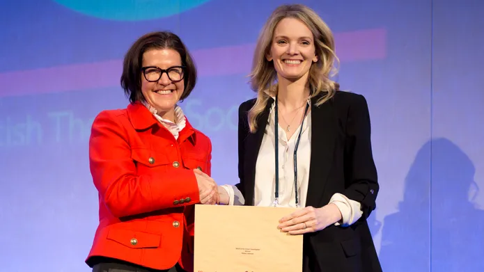 Emma Johnson (on right) receives an award from Early Career Investigator Award by the British Association for Lung Research and British Thoracic Society