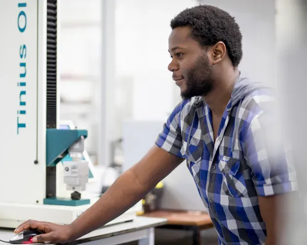 student working on equipment