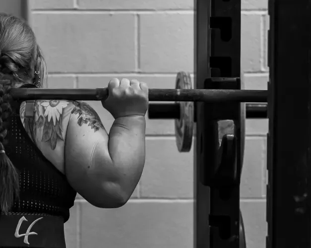 Irene Hallyburton preparing to lift a weight
