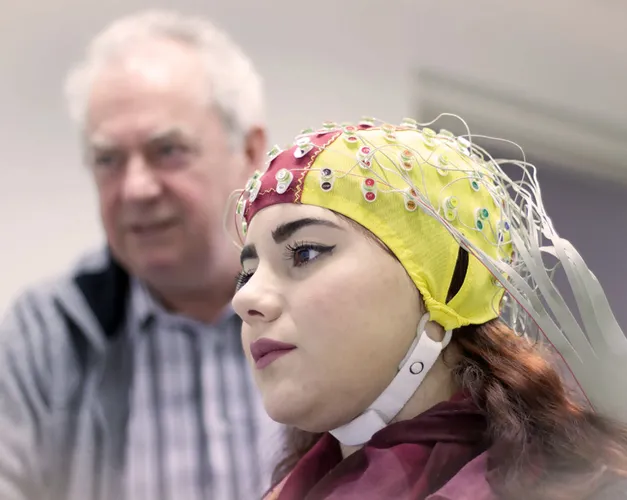 Woman wearing brain imaging cap