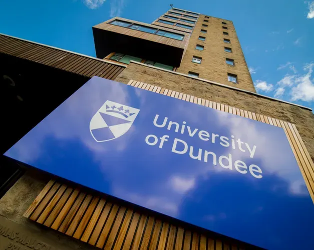 image of University of Dundee sign on the dies of a building