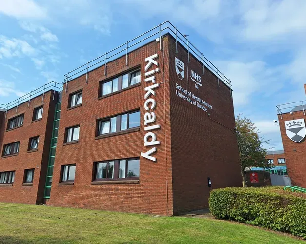 A brown bilding that reads "Kirkcaldy" down the side of the building