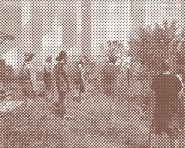 Sepia toned photograph of people standing together in a garden