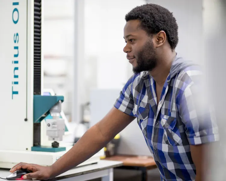 student working on equipment