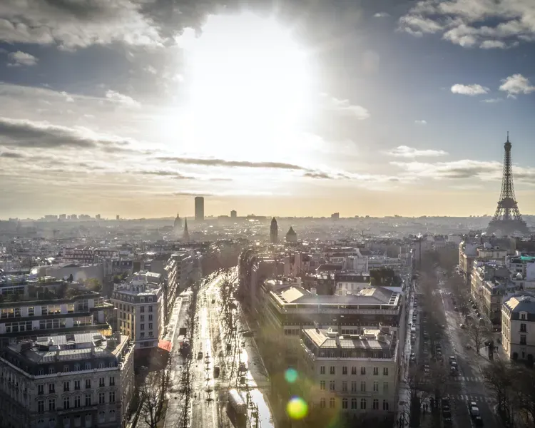 View of Paris and the Eiffel Tower with a bright winter sun low in the sky
