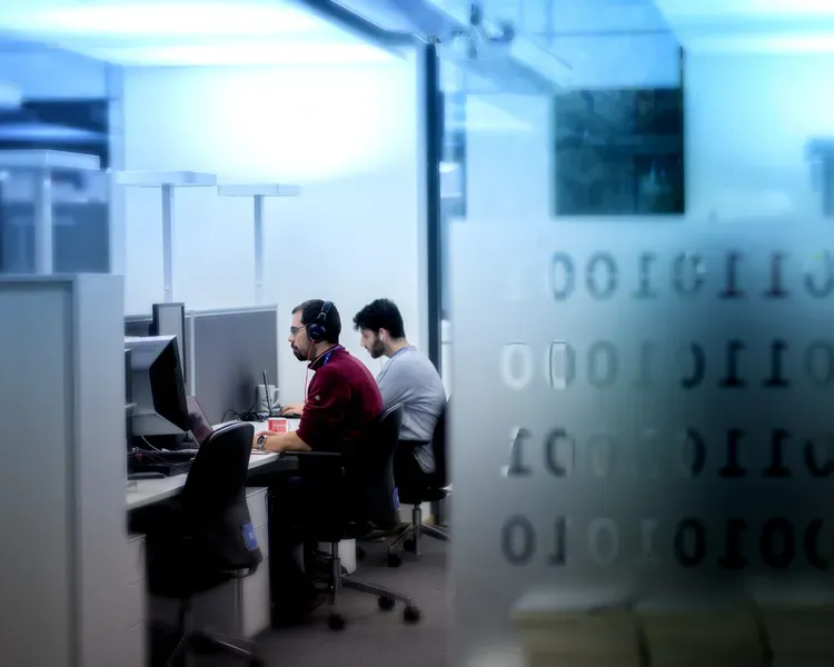 Two students sat at computers