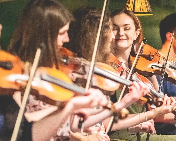 student playing violin at the University of Dundee
