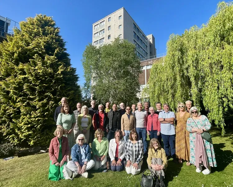 A group of people attending a reunion outside the University of Dundee's dental hospital